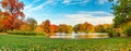 Autumn panorama pond and trees in park Royalty Free Stock Photo