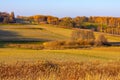 Autumn panoramic view of hill fields and meadows with forest surrounding Zagorzyce village in Podkarpacie region of Poland