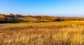 Autumn panoramic view of hill fields and meadows with forest surrounding Zagorzyce village in Podkarpacie region of Poland