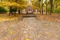 Autumn park with a footpath to a building Royalty Free Stock Photo