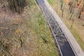 Autumn park landscape in cloudy day. bare trees and fallen yellow foliage on ground. aerial view Royalty Free Stock Photo