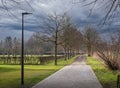 Autumn park landscape. Walking path leading to the forest area Royalty Free Stock Photo