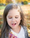 Autumn park: portrait beautiful little girl Royalty Free Stock Photo