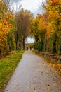 Autumn path with two cyclists Royalty Free Stock Photo