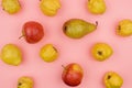 Autumn pears, apples, quince on a pink background