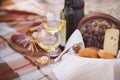 Autumn picnic by the sea with wine, grapes, bread and cheese Royalty Free Stock Photo