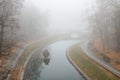 Autumn pond Cozy alley in a city foggy park in the fall. Gomel, Belarus Royalty Free Stock Photo