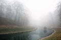 Autumn pond Cozy alley in a city foggy park in the fall. Gomel, Belarus Royalty Free Stock Photo