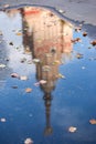 Autumn pool with fallen leaves and building reflection in campus of famous Russian university