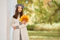 Portrait of a beautiful woman in an autumn park Royalty Free Stock Photo