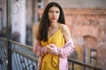 Woman in yellow dress and pink blazer Royalty Free Stock Photo