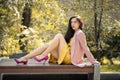 Woman in yellow dress and pink blazer Royalty Free Stock Photo