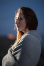 Autumn portrait of beauty redhead girl outdoors in twilight.