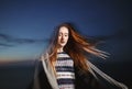 Autumn portrait of beauty redhead girl outdoors in twilight. Royalty Free Stock Photo