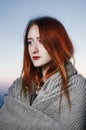 Autumn portrait of beauty redhead girl outdoors in twilight.