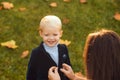 Autumn portrait of cute little caucasian child boy. Fall leaves children concept.