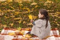 Autumn portrait lonely girl in the autumn park.