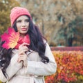 Autumn portrait of perfect woman with red maple leaf Royalty Free Stock Photo