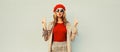 Autumn portrait of stylish beautiful young woman model blowing her lips sends sweet air kiss wearing red french beret hat, jacket Royalty Free Stock Photo