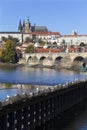 Colorful autumn Prague gothic Castle and Charles Bridge with the Lesser Town in the sunny Day, Czech Republic Royalty Free Stock Photo