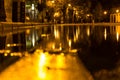 Autumn. A puddle on the pavement with a reflection of lanterns in the evening. Autumn Royalty Free Stock Photo