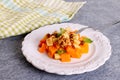 Autumn Pumpkin Apple Salad. Dietary salad with pumpkin, nuts and apples Royalty Free Stock Photo