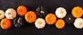 Autumn pumpkin banner Halloween colors against a black stone background