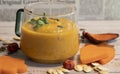 autumn pumpkin cream soup with seeds, vegetarian food