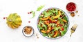 Autumn pumpkin salad with baked honey pumpkin slices, lettuce, arugula, pomegranate seeds and walnuts. Healthy vegan eating, Royalty Free Stock Photo