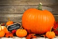 Autumn pumpkins with Happy Thanksgiving chalkboard tag