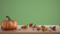 Autumn pumpkins still life on wooden table isolated on green background. Falling leaves, Thanksgiving Halloween decoration with Royalty Free Stock Photo