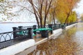 Autumn quay after rain empty benches and wet asphalt Royalty Free Stock Photo