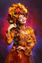 Autumn queen - beautiful woman in flower wreath