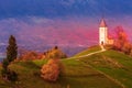 Sunset with church on top of hill, Slovenia Royalty Free Stock Photo