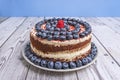 Autumn Red Velvet Cake: Decorated with blueberries, fresh figs, and caramelized pecans Royalty Free Stock Photo