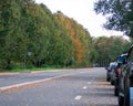 Autumn road with cars Royalty Free Stock Photo