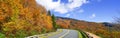 Autumn road panorama in the mountains. Royalty Free Stock Photo