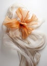 Autumn romance, vintage flower made of silk fabric develops in the wind, muted beige tones on a white background