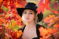 Autumn romance woman with leaves. Female model on foliage day. Dream and lifestyle. Beauty outdoor portrait. Carefree