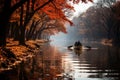 Autumn Rowing Rowers gliding on a reflective lake - stock photo concepts
