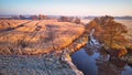 Autumn rural landscape. Frost on grass. River, Corn field, meadow, village, fall color trees Royalty Free Stock Photo