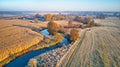 Autumn rural landscape. Frost on grass. River, Corn field, meadow, village, fall color trees Royalty Free Stock Photo