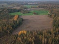 Autumn, rural landscape, plowed field and forests, drone photo