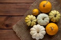 Autumn rustic composition with decorative pumpkins on the wooden table. Thanksgiving concept, autumn mood. Copy space Royalty Free Stock Photo