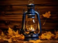 Autumn's Beacon: Vintage Lantern Casting a Warm Glow Among Maple Leaves on a Cobalt Canvas