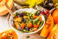 Autumn salad with baked pumpkin, beet, zucchini and carrots. Healthy vegan food concept