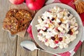 Autumn salad with chicken, apples, nuts, cranberries, above on wood Royalty Free Stock Photo