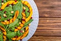 Autumn salad with pumpkin spinach , pomegranate and chickpea . Healthy vegan food