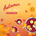 Autumn sale background with punch in a bowl and cups, slices of oranges, apples, spices, pumpkins, leaves on a table.
