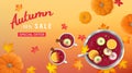 Autumn sale horizontal banner with punch in a bowl and cups, slices of oranges, apples, spices, pumpkins, leaves on a table.